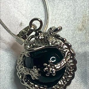 Onyx dragon silver ball in a silver snake chain.